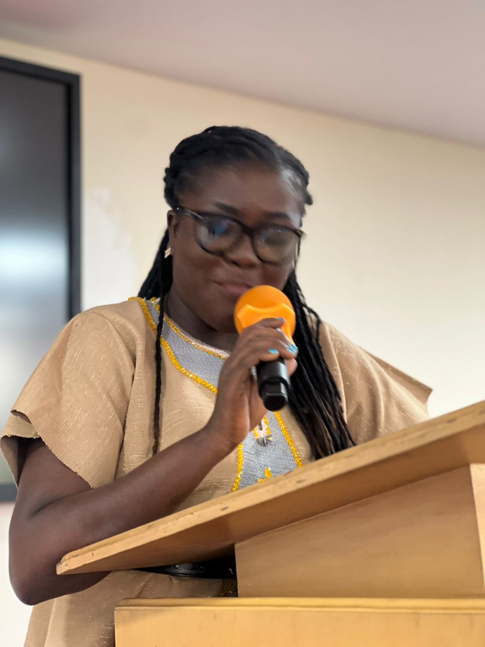 A close-up speaking moment during the official launch of the Agenda Wear Ghana Campaign.